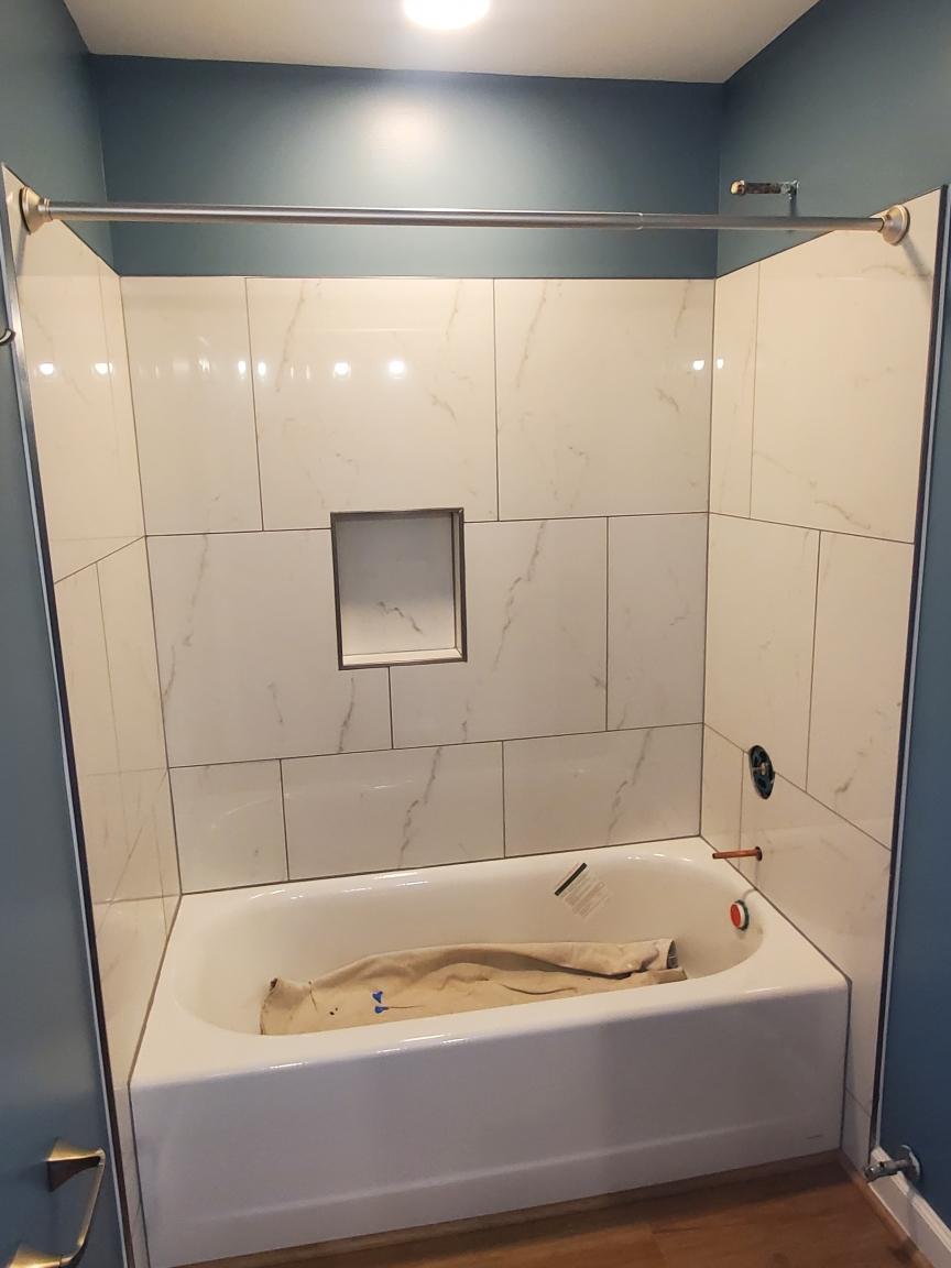 Double vanity with gold fixtures and arched mirrors - Bradie's Custom Construction, Fredericksburg VA